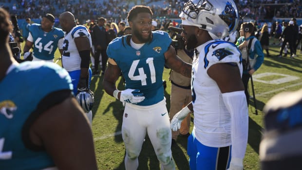 Jacksonville Jaguars linebacker Josh Allen (41) greets Carolina Panthers linebacker Brian Burns (0) after the game of a regular season NFL football matchup Sunday, Dec. 31, 2023 at EverBank Stadium in Jacksonville, Fla. The Jacksonville Jaguars blanked the Carolina Panthers 26-0. [Corey Perrine/Florida Times-Union]